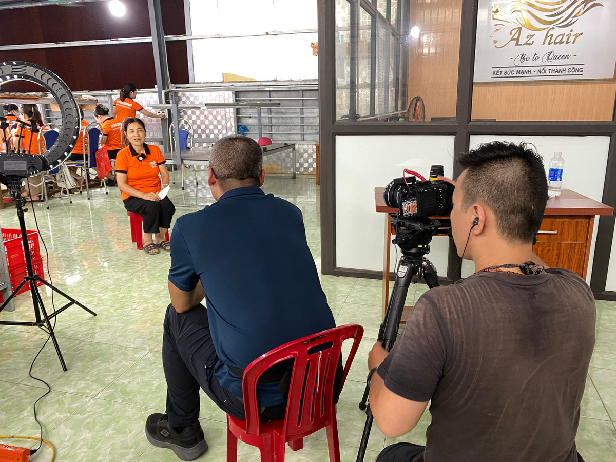 Channel NewsAsia crew filming inside the AZ Hair Vietnam factory
